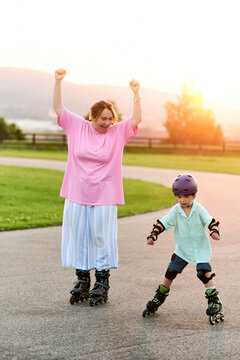 Mother Celebrating Son Learning to Roller Skate