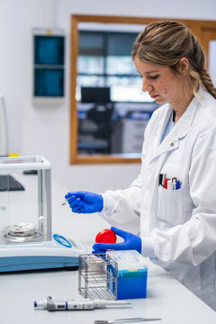 Scientist Conducting an Experiment in a Laboratory During the Day