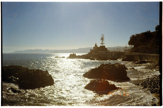 Sunlight glinting on coastal rocks