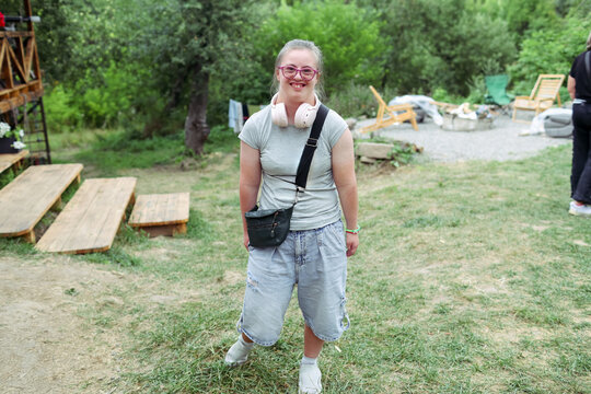 Outdoor activity with a child with Down syndrome at a camp
