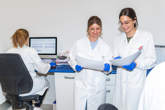 Scientists Work Together in Laboratory Setting During the Day