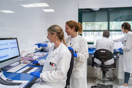 Scientists Work Together in a Laboratory on Research Projects