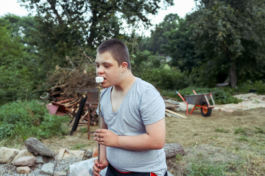 Outdoor activity with a child with Down syndrome at a camp