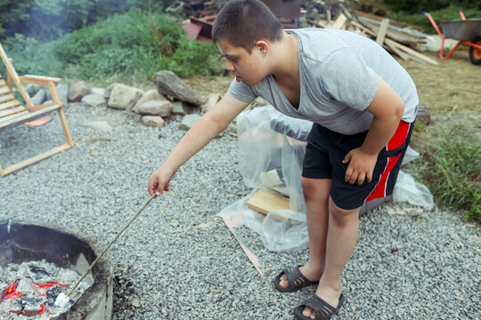Outdoor activity with a child with Down syndrome at a camp