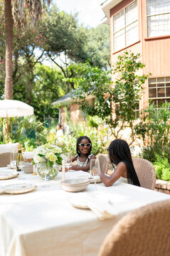 Lunch Gathering in a Garden Setting With Friends