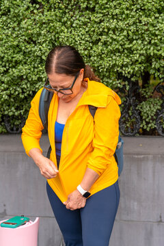 woman zipping up jacket