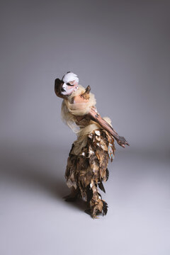 Drag Performer as a Fallen Angel with Burned Wing Prosthetics