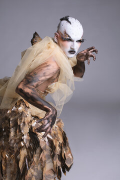 Drag Performer as a Fallen Angel with Burned Wing Prosthetics