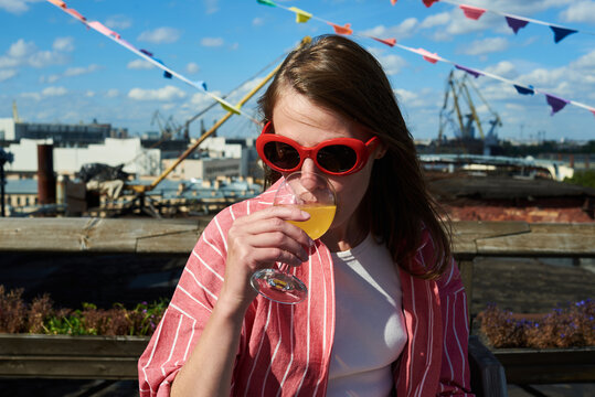 Woman drinking cider outdoors