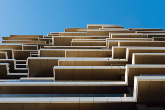 Geometric Balconies Against a Blue Sky
