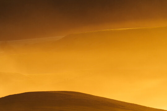Amber Haze Over Rolling Hills