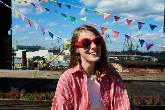 Portrait of smiling woman sitting outdoors