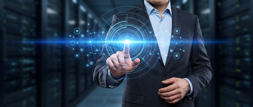 Businessman interacting with circular hologram in server room center.