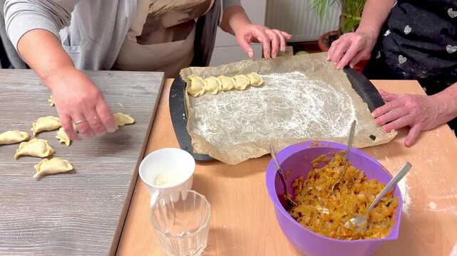 Arranging Prepared Dumplings on Baking Sheet with Flour