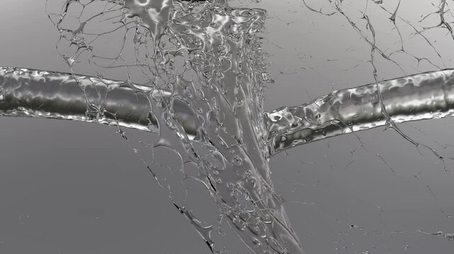 Close-up view of two streams of clear liquid merging into a single flowing body with visible bubbles and splashes against a gray gradient background.