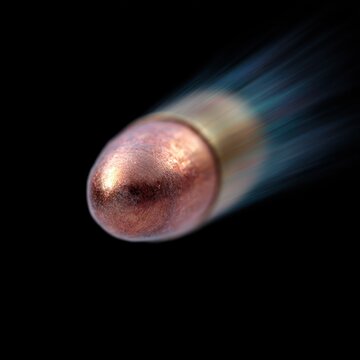 A metallic bullet races forward leaving trails of energy in a dark backdrop