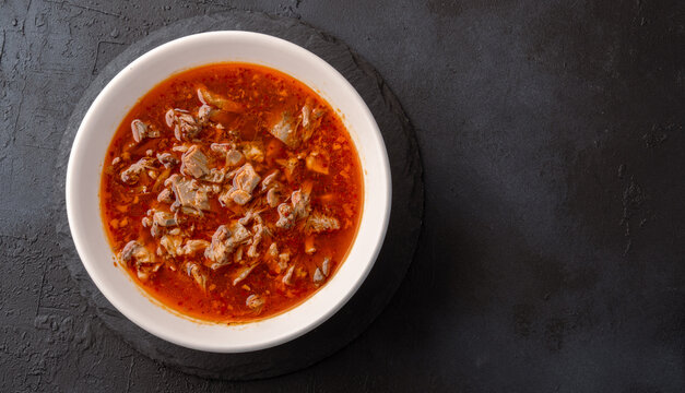 Traditional Turkish Kelle Paca Soup on Black Stone Table Background