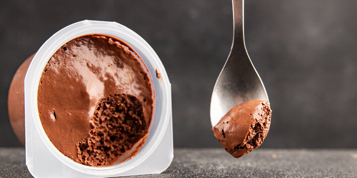 Chocolate Mousse sweet dessert light and airy texture serving size plastic container natural ingredients healthy eating, wholesome tasty snack fresh, gourmet, rustic food background 