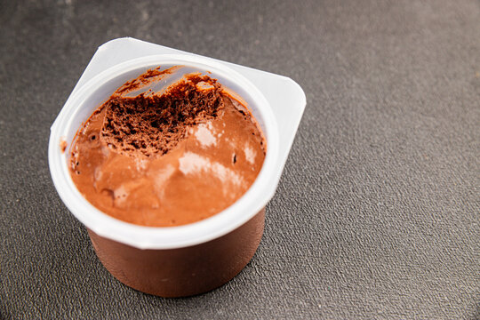 Chocolate Mousse sweet dessert light and airy texture serving size plastic container natural ingredients healthy eating, wholesome tasty snack fresh, gourmet, rustic food background 