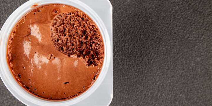 Chocolate Mousse sweet dessert light and airy texture serving size plastic container natural ingredients healthy eating, wholesome tasty snack fresh, gourmet, rustic food background 