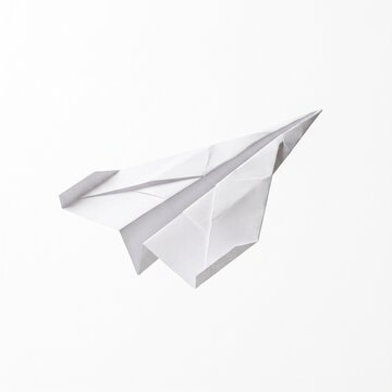 Minimalist white paper plane on white background, origami paper airplane for business startup concept, clean geometric paper craft glider