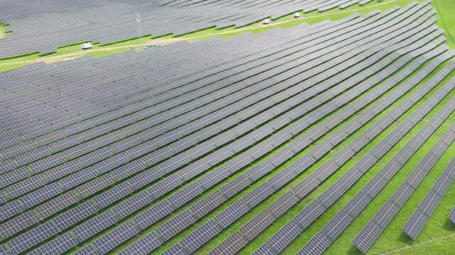 Top-Down Aerial Close-Up View of Solar PV Panel Array on Zoige Grassland: Renewable Clean Energy, Agrivoltaics, Green Field and Sunlight Background