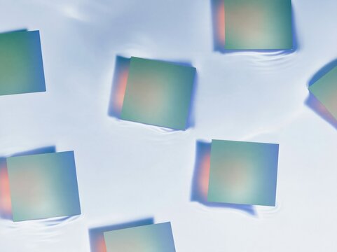 Mint translucent squares floating on calm white water, a glowing abstract representation of streaming services for digital subscriptions