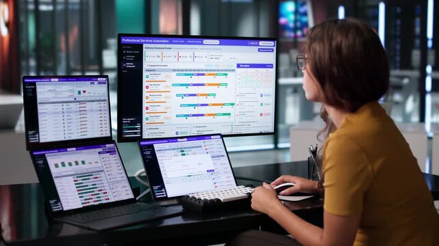 Young Latina Consultant Using Dual Laptops