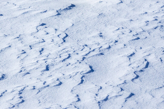 Natural winter background with snow drifts