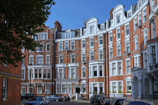 London, curved street with five story apartment buildings in Chelsea district
