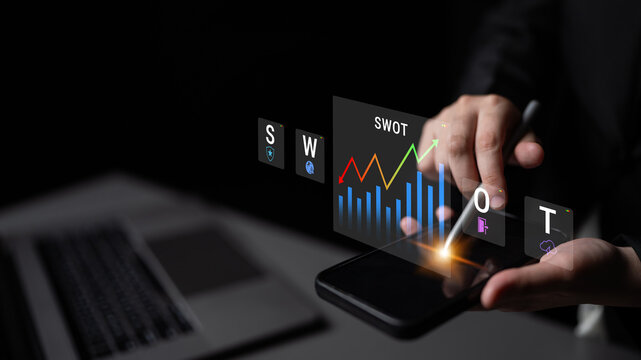 A business professional examines a SWOT analysis displayed on a smartphone screen, showcasing modern technology and data visualization for strategic planning in business development. Nascent