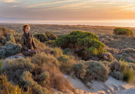 Listening to nature on a dune at golden hour