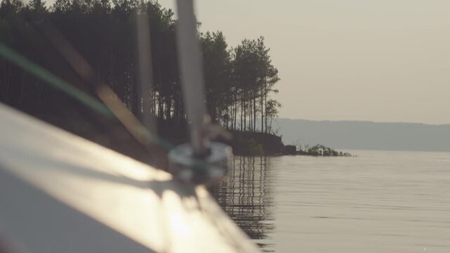 Detail of the sailing boat moving on the lake