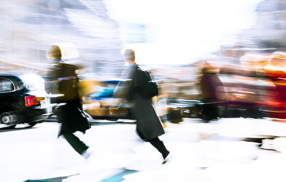 Artistic motion of people with shopping bags crossing Oxford Circus junction at sunny day. London