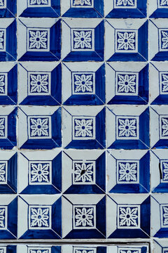 Traditional blue and white Portuguese azulejo ceramic tile pattern background texture closeup