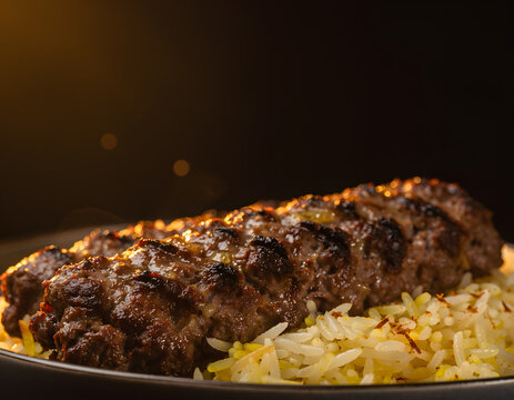 Charred Iranian Chelo Kebab Koobideh Skewer on Saffron Steamed Rice with Moody Lighting