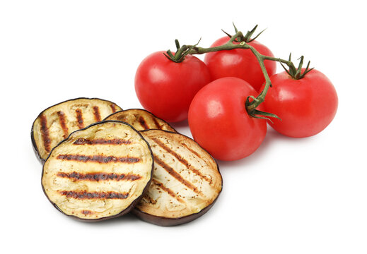 Slices of grilled eggplant and tomatoes isolated on white