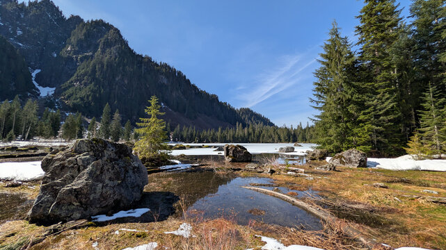 Heather Lake with Snow Covered Mountains and Evergreen Forest in Washington State