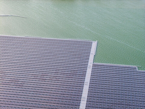 A stunning aerial view showcases solar panels installed on a floating platform at Waduk Karangkates