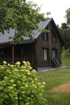 Cozy wood scandinavian house in sunny day in summer