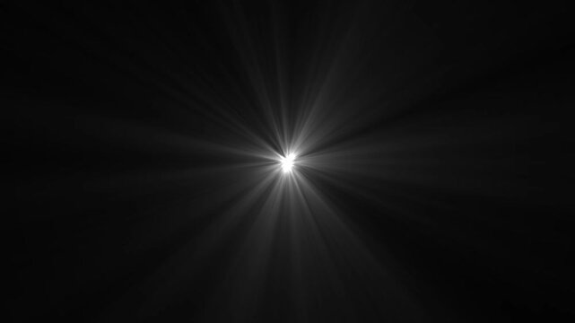 White sun flare star light glow shining rays effect on black chroma key alpha channel background. Warm light rays looping animated 4k background