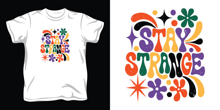 Stay strange retro groovy typography design featuring colorful flowers and starburst shapes for hippie aesthetic apparel and creative posters.