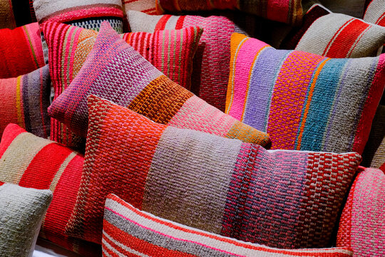 Striped woven pillows in colorful warm tones