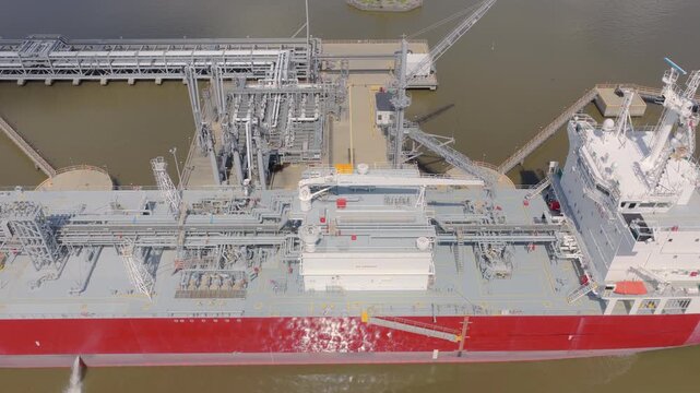 Aerial view of a chemical tanker ship moored at an industrial dock