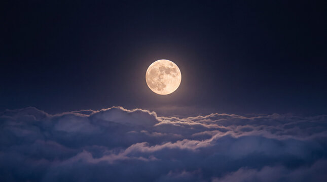 Full moon glowing above a soft blanket of illuminated clouds in a dark blue night sky, peaceful celestial landscape with atmospheric light and dreamy serenity