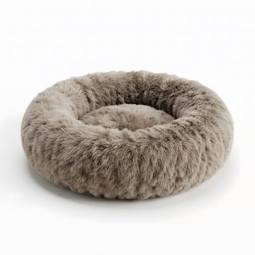 A comfortable round pet bed made of soft fluffy faux fur material in a neutral grey color isolated on a clean white studio
