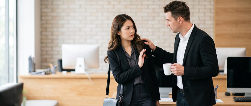 Businesswoman raising her hand in a stop gesture as a male coworker touches her shoulder during an uncomfortable office interaction, expressing rejection and setting personal boundaries at work, inapp