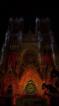 The light show Regalia on the facade of Reims Cathedral Notre-Dame de Reims. Reims, France, December 25, 2025. High quality 4k footage
