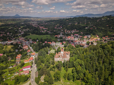Bran Castle Medieval Fortress in Transylvania with Surrounding Town and Carpathian Mountains