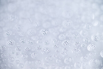 Close up of Black and White Abstract Water Drops on Glass Background © Anna Hoychuk